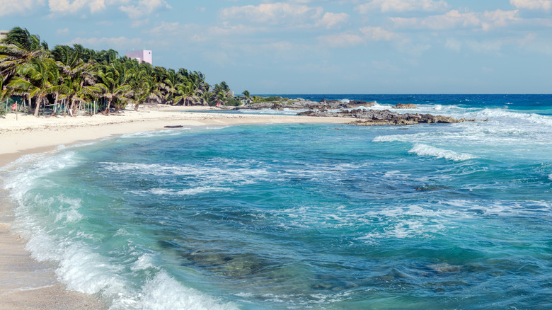 Playa Norte, a blue flag beach in Isla Mujeres, Mexico, on a sunny day.