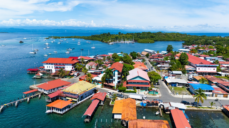 Aerial view of colorful buildings, docks, and boats on Isla Colon