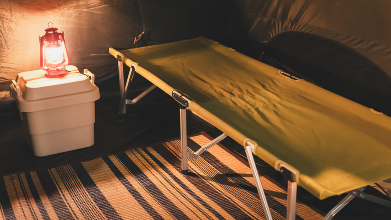 Camping cot in a tent