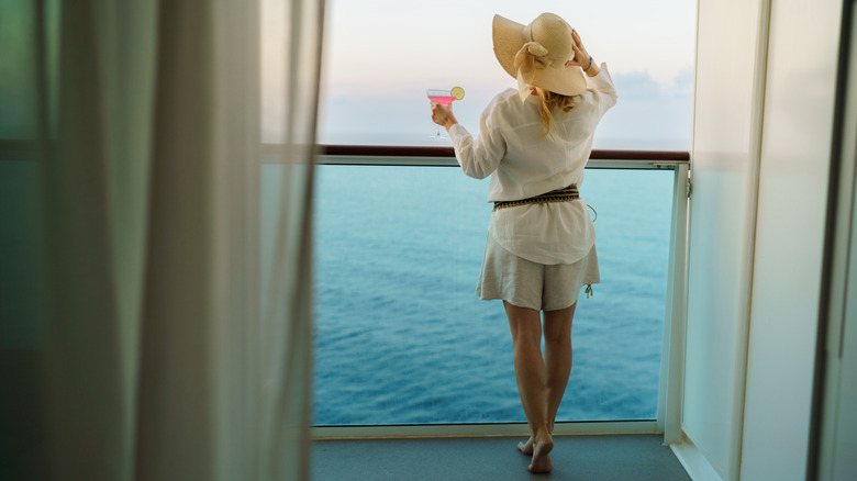 Rear view of a woman on the balcony of a cruise ship