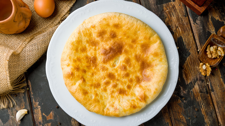 Georgian khachapuri, a traditional cheese bread, on a plate