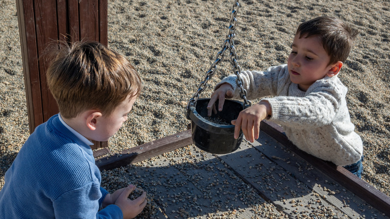 Two boys engaging in sensory activities