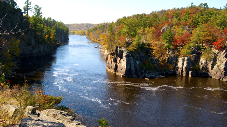Rocky cliffs and fall foliage along the St. Croix River