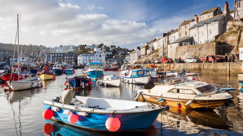 Fishing boats bobbing in the harbor in Mevagissey in Cornwall