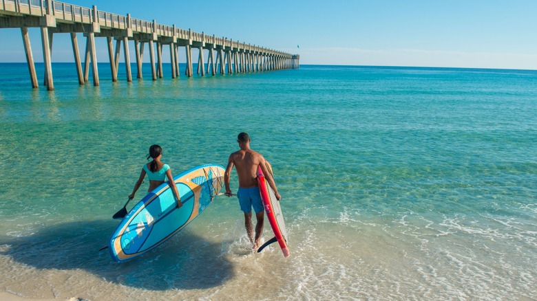 Going paddleboarding next to the Pensacola Beach Fishing Pier