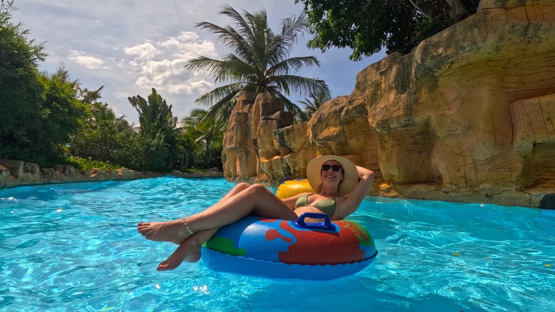 Woman floating on a lazy river