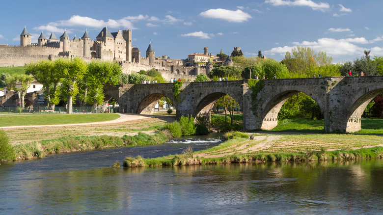 Canal flowing through the medieval village of Carcassonne, France