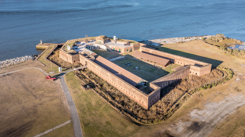 Aerial view of Old Fort Jackson with the battlements, walls, cannons, lawns, and Savannah River