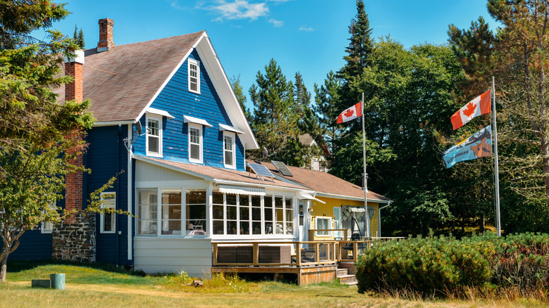 Charming cottage with Canadian flags outside