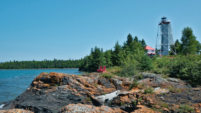 Lighthouse and rocky lakeshore