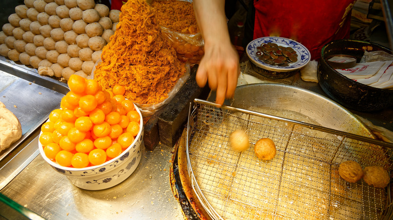 A vendor preparing deep-fried taro balls at the Ningxia Night Market