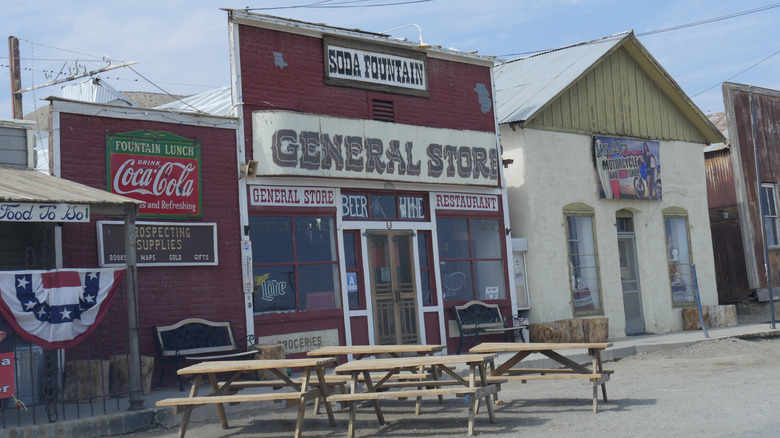 Entrance of the Randsburg General Store with picnic tables out front