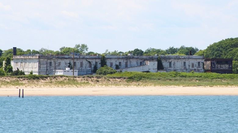 A large building on the sandy shore of Plum Island, New York