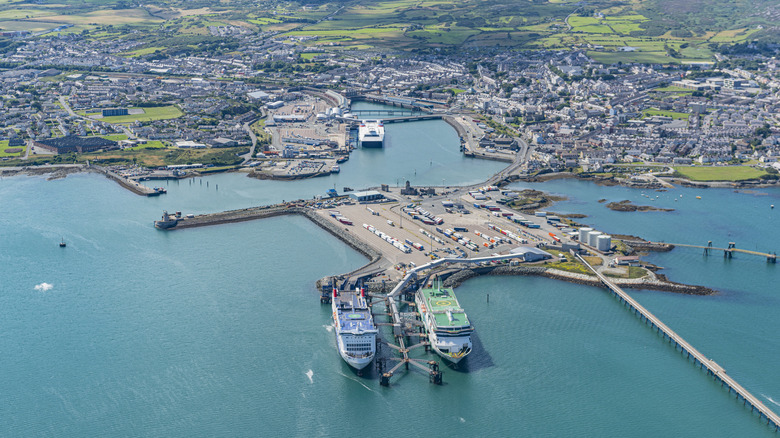 An aerial photo from above to sea looking at Holyhead port and the town sprawling into the coutryside