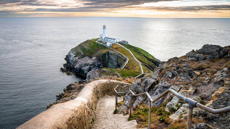 South Stack Lighthouse on a peninsula with 400 winding stairs cut into a rocky cliff