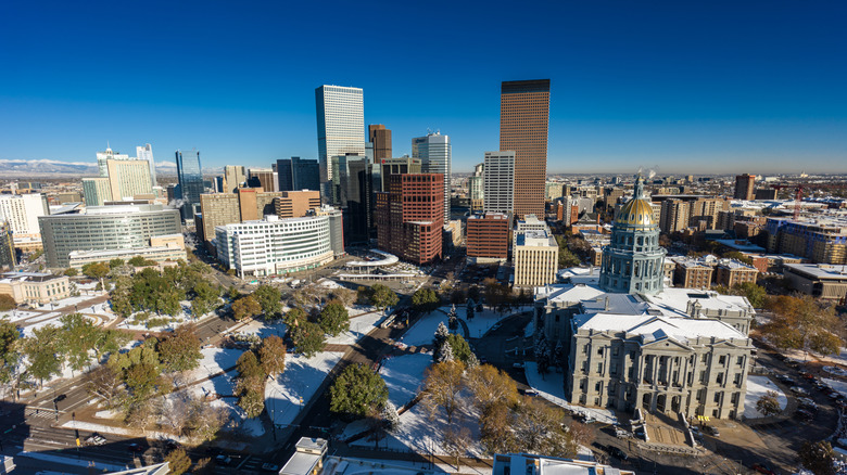 Aerial view of buildings in Denver with a blue sky