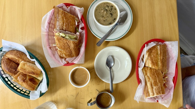 A spread of Cuban bread, coffees, and sandwiches at West Tampa Sandwich Shop