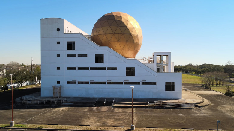 A side view of the Palace of the Golden Orbs in Houston