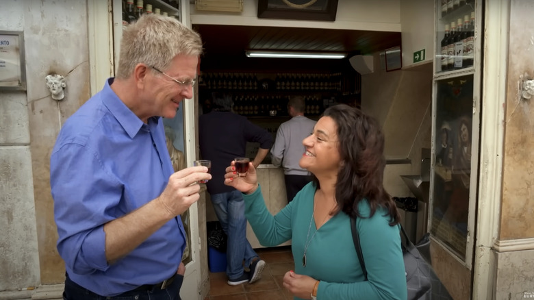 Rick Steves and a guide outside a ginjinha bar