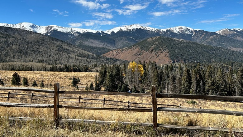 Snow-dusted mountains and forests seen from the Highway of Legends