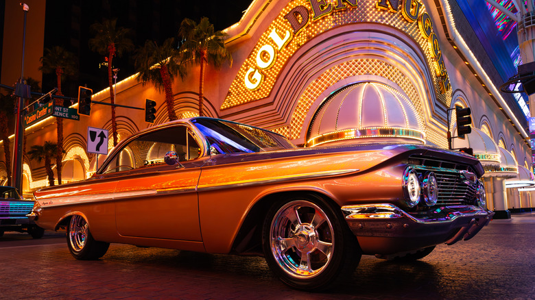 Muscle car parked outside of the Golden Nugget Casino on Fremont Street at night