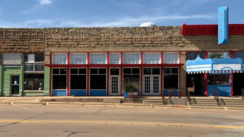 Brick and painted facades on street Royal Theater Archer City Texas