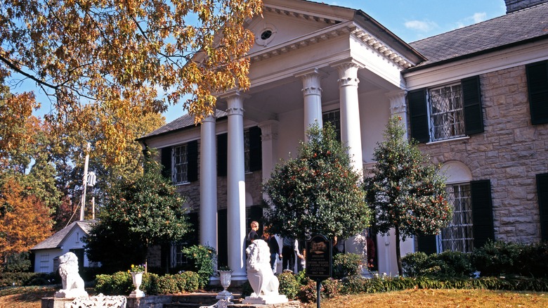 Graceland entrance with lions and fall trees