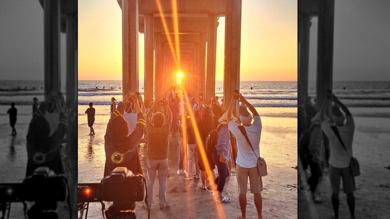 Shot of photographers under La Jolla's Scripps Pier to capture the sunset