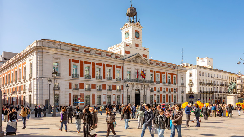 People walking on Puerta del Sol plaza in Madrid
