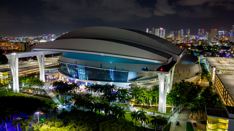 Aerial view of loanDepot Park lit up at night in Miami, home of Miami Marlins.