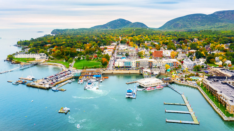 Aerial view of Bar Harbor on Mount Desert Island in Maine, with turquoise waters, piers and colorful buildings