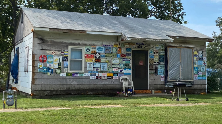 A house adorned with antique signs in McLouth, Kansas