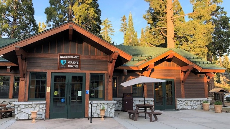 Timber exterior of Grant Grove Restaurant backed by forest.
