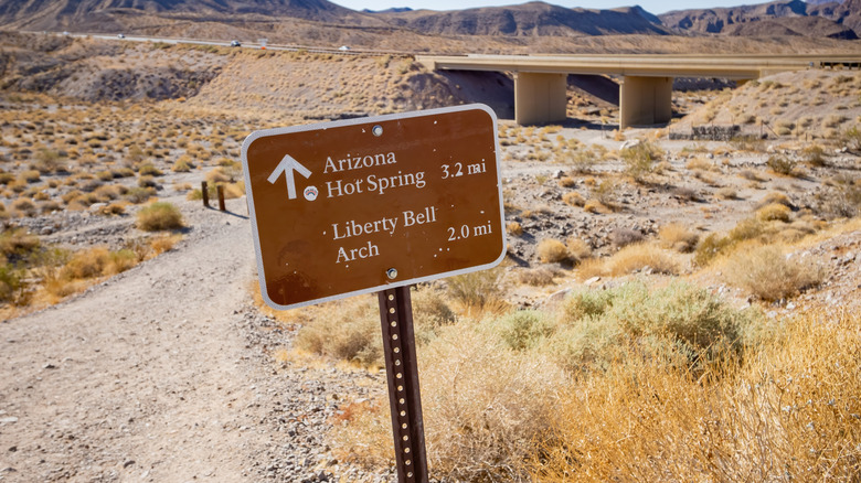 A sign for Arizona Hot Spring Trail and Liberty Bell Arch
