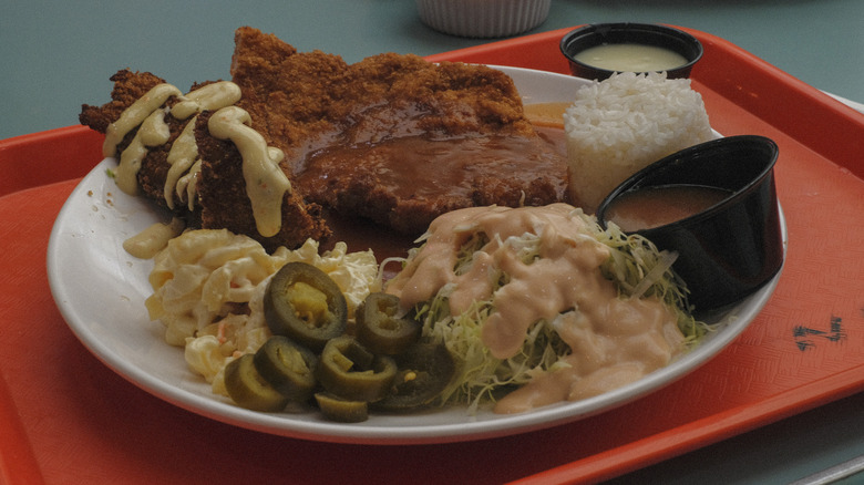 A plate of donkassu and fried fish with banjan at the Koreatown Plaza food court in Los Angeles