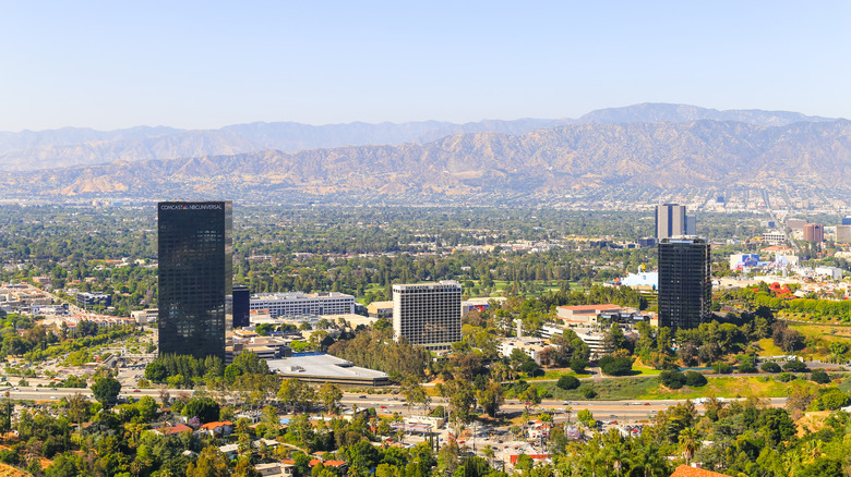 Aerial view of Studio City buildings with mountains in background.