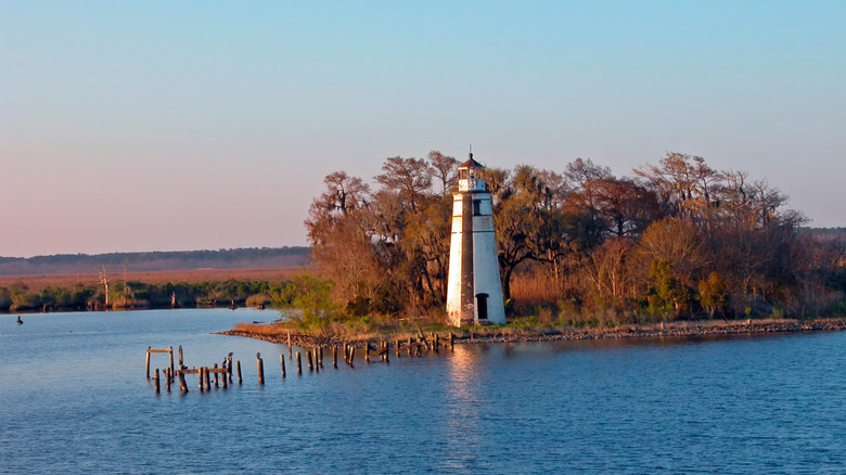 Old lighthouse with fall foliage in St. Tammany Parish