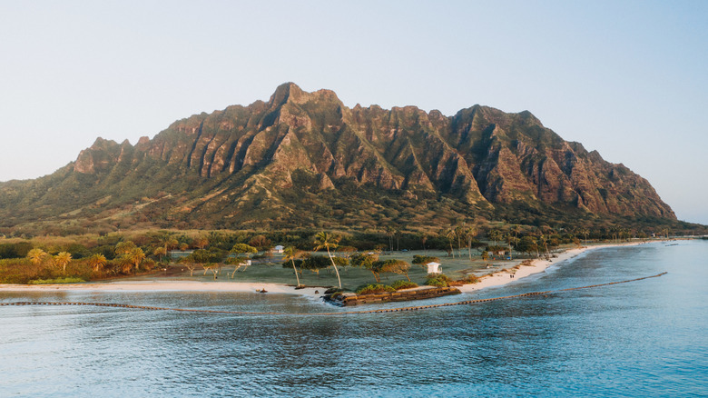 Kualoa Ranch set against mountains in Kāneʻohe, Hawaii