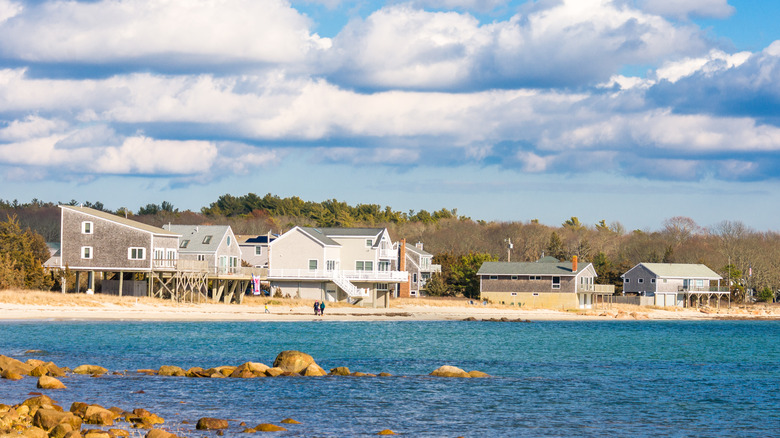 People walking the beach in Mattapoisett, MA