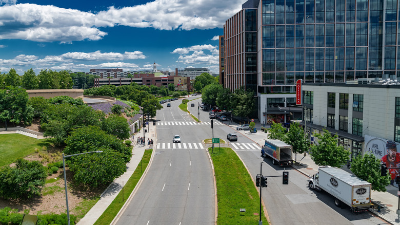 Aerial view of a street in Washington, D.C., surrounded by greenery and buildings