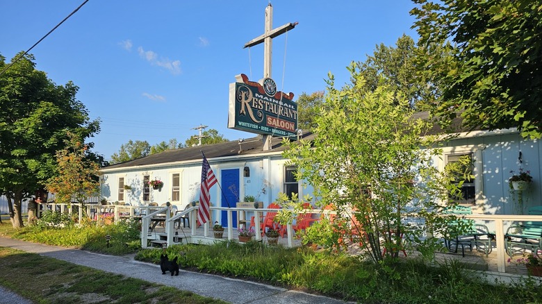 One-story building with a sign reading Mainsail Restaurant & Saloon in DeTour Village
