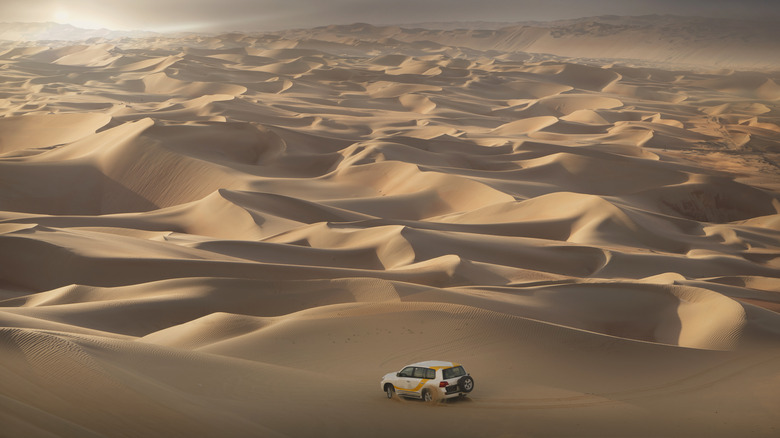Driving on dunes in the desert just outside of Abu Dhabi, United Arab Emirates