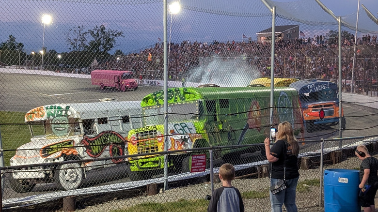 Colorful buses race at the Flat Rock Speedway