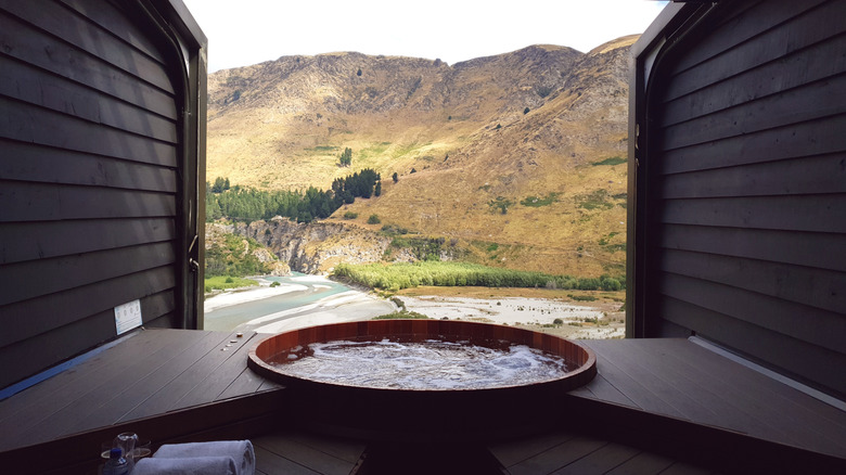 View over mountains and river from hot tub at Onsen Hot Pools