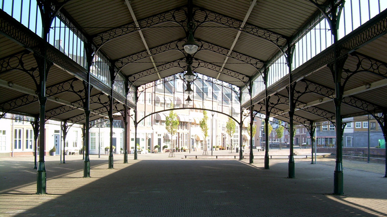 Cast-iron market hall in Brandevoort's town center on sunny day