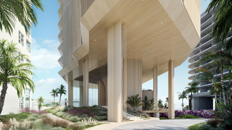 Exterior view of the entrance to the residential tower and adjacent hotel, part of the planned Aman Miami Beach complex, overlooking the Atlantic Ocean and surrounded by lush foliage in Miami Beach, Florida, USA