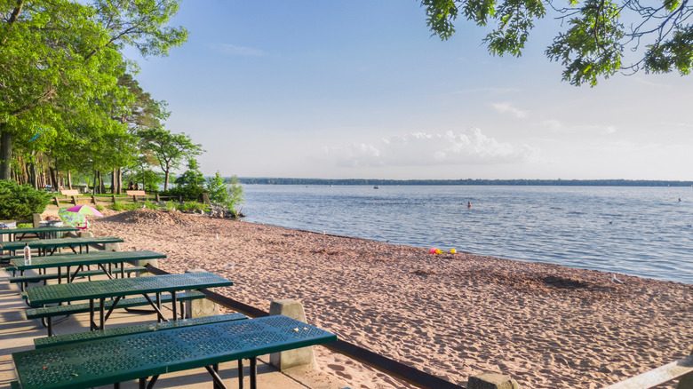 White sand and picnic tables at Verona Beach park in Upstate New York.