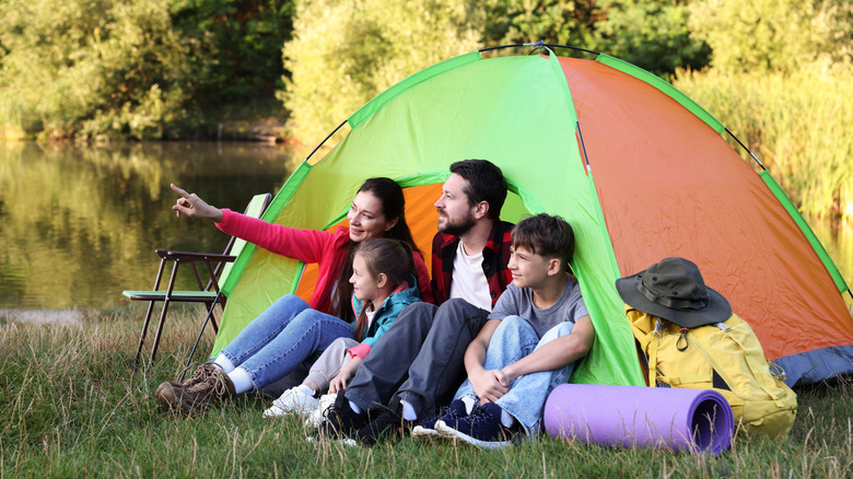 A family camping in a tent