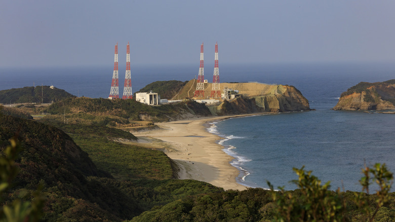 Satellite towers between hills and by the beach in Tanegashima