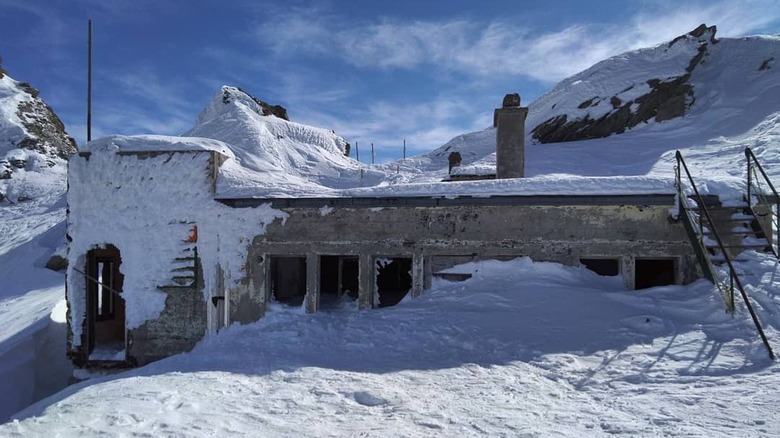Abandoned building covered in snow at Super Saint Bernard in Switzerland
